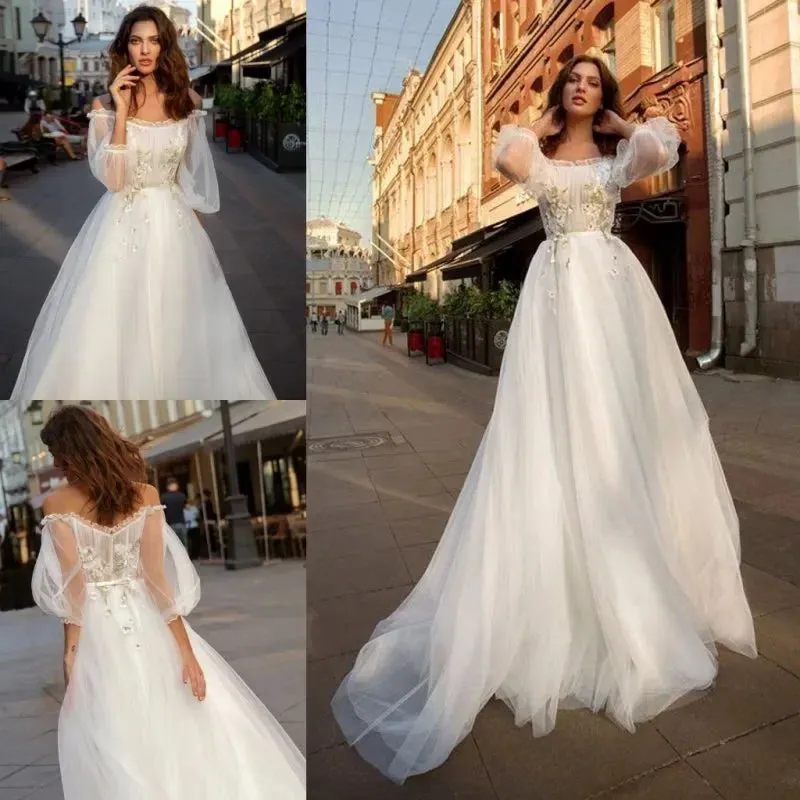 Long sleeve  off-the-shoulder sweep train A -Line wedding dress